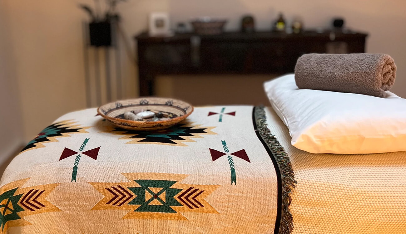 Massage table and towels at Hozho Wellness in Brighton and Hove