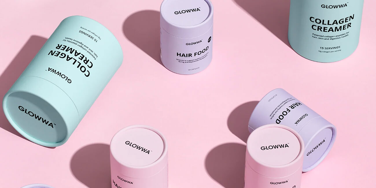 Glowwa Hair Food product boxes on a pink background